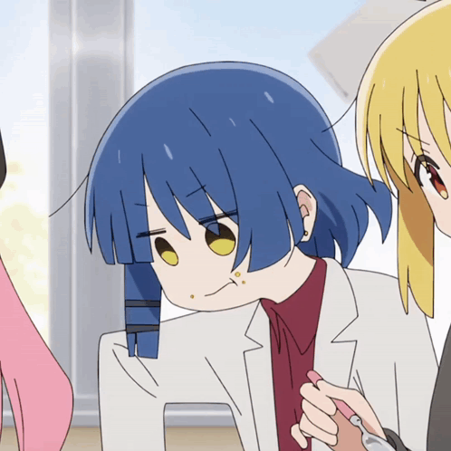 A Cartoon Girl With Blue Hair And Yellow Eyes Looks At The Camera GIF