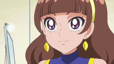 A Cartoon Girl With Brown Hair And Yellow Earrings Is Smiling GIF