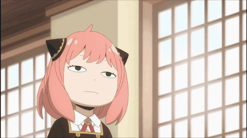 A Cartoon Girl With Pink Hair And Black Ears Is Making A Funny Face GIF