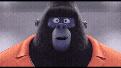 A Cartoon Gorilla Wearing An Orange Collared Shirt GIF