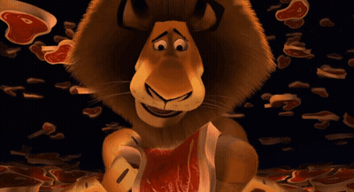 A Cartoon Lion Eating A Piece Of Meat With His Tongue Hanging Out GIF