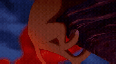 A Cartoon Lion Is Standing On A Rock In Front Of A Fire Background GIF