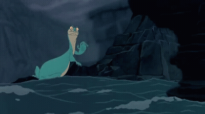 A Cartoon Lizard Is Sitting In The Water Near A Rock . GIF