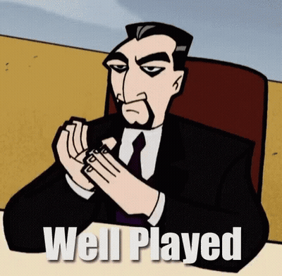 A Cartoon Man In A Suit And Tie Is Sitting At A Table With The Words Well Played Written Below Him GIF