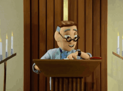 A Cartoon Man Is Giving A Speech At A Podium With Candles In The Background GIF
