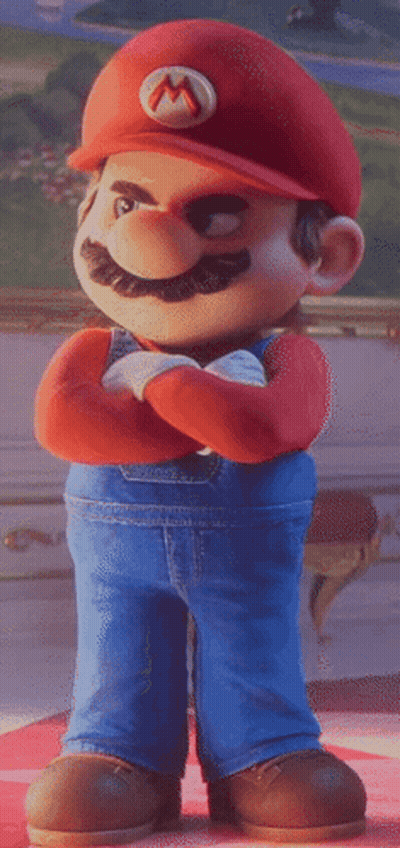 A Cartoon Mario With His Arms Crossed And A M On His Hat GIF