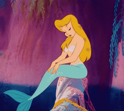 A Cartoon Mermaid Is Sitting On A Rock In The Water GIF