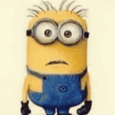 A Cartoon Minion With Big Eyes And A Mustache Is Wearing Blue Overalls And Glasses . GIF