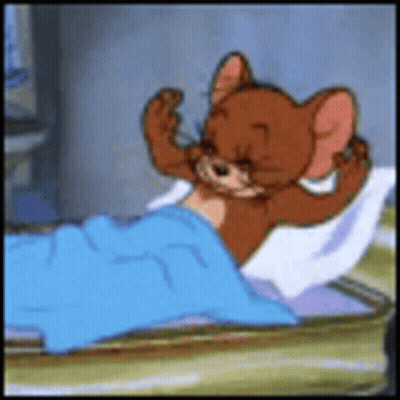 A Cartoon Mouse Is Laying In A Bed With A Blue Blanket On It . GIF