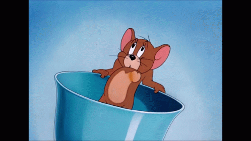 A Cartoon Mouse Is Sitting In A Blue Bowl GIF