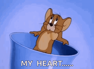A Cartoon Mouse Is Sitting In A Blue Cup With The Words `` My Heart '' Written On It . GIF