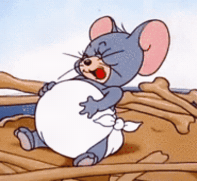 A Cartoon Mouse Is Sitting On A Pile Of Bones And Holding His Belly GIF