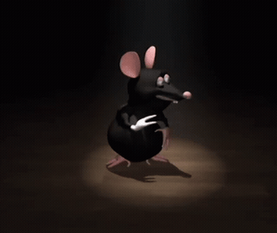 A Cartoon Mouse Is Standing In The Dark And Pointing GIF