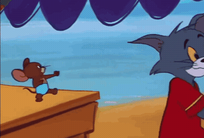 A Cartoon Mouse Is Standing On A Table Next To A Striped Balloon . GIF