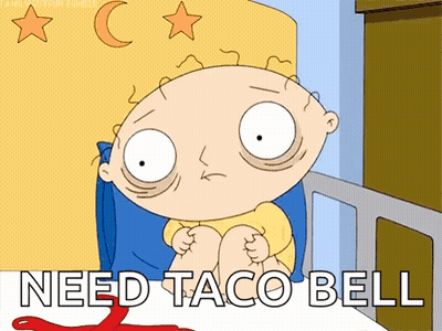 A Cartoon Of A Baby Sitting In A Bed With The Words Need Taco Bell Below Him GIF