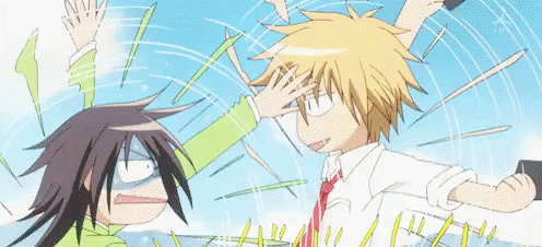 A Cartoon Of A Boy And A Girl Fighting With Their Hands In The Air . GIF