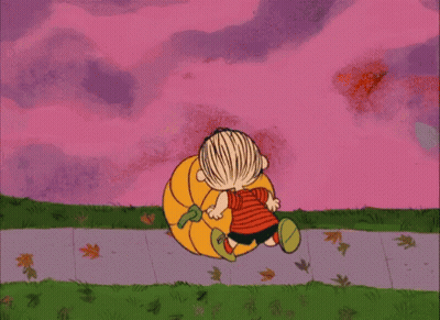 A Cartoon Of A Boy Carrying A Pumpkin On A Sidewalk GIF