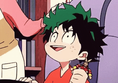 A Cartoon Of A Boy Holding A Toy In His Hand . GIF