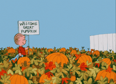 A Cartoon Of A Boy In A Pumpkin Patch Holding A Welcome Great Pumpkin Sign GIF