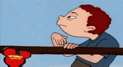 A Cartoon Of A Boy Pointing At A Disney Mouse Head GIF