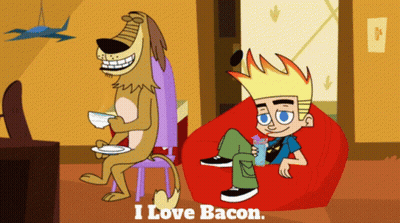A Cartoon Of A Boy Sitting On A Bean Bag Chair Next To A Dog That Says " I Love Bacon " On It GIF