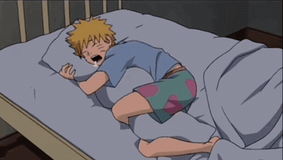 A Cartoon Of A Boy Sleeping On A Bed With His Mouth Open GIF