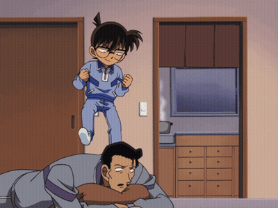 A Cartoon Of A Boy Standing On Top Of A Man Laying On The Floor GIF