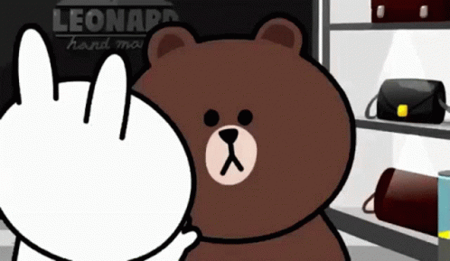 A Cartoon Of A Brown Bear And A White Rabbit In Front Of A Sign That Says Leonardo GIF
