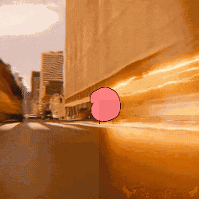 A Cartoon Of A Bubble Gum Character Is Driving Down A Street GIF
