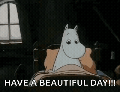 A Cartoon Of A Cat Laying In A Bed With The Words `` Have A Beautiful Day ! '' GIF
