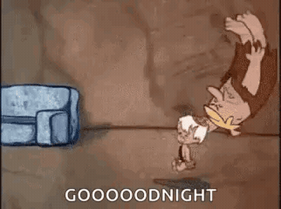 A Cartoon Of A Caveman Standing On His Head Next To A Bag And A Couch . GIF