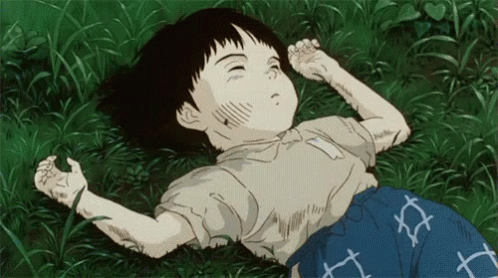 A Cartoon Of A Child Laying In The Grass GIF