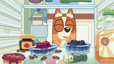 A Cartoon Of A Dog In A Fridge With A Bottle Of Orange Juice GIF