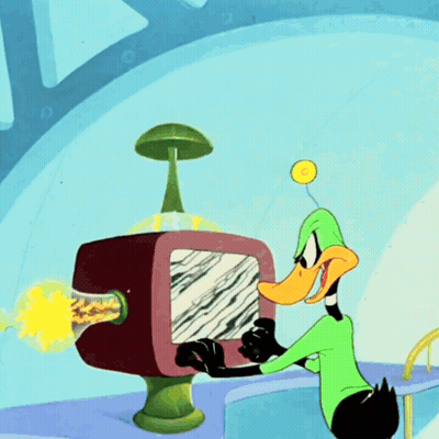 A Cartoon Of A Duck Looking At A Computer Screen GIF