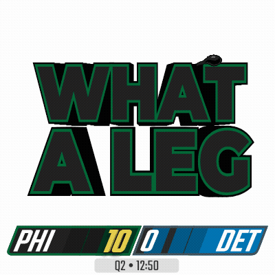 A Cartoon Of A Football Player Holding Up A Scoreboard That Says Phi 10 Det GIF
