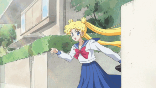 A Cartoon Of A Girl In A Blue Skirt And White Top With A Red Bow GIF