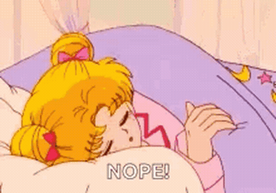 A Cartoon Of A Girl Sleeping In A Bed With The Words `` Nope '' Written On The Blanket . GIF