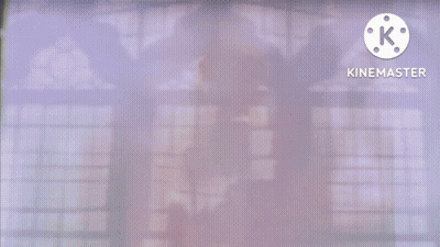 A Cartoon Of A Girl With Long Green Hair And A Green Arrow Pointing To A Blue Blob With The Letter K On It GIF