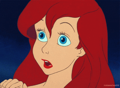 A Cartoon Of A Girl With Red Hair And Blue Eyes GIF