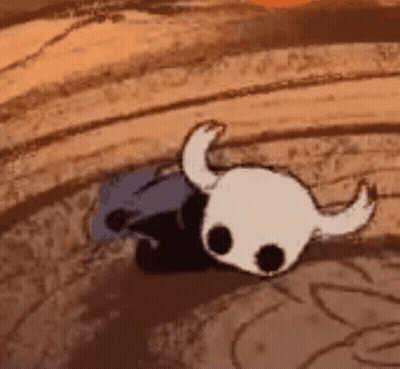 A Cartoon Of A Knight 'S Skull With Horns Is Laying On The Ground . GIF