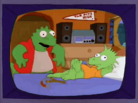 A Cartoon Of A Lizard Laying On A Bed With A Banner That Says Tar Pits High On It . GIF