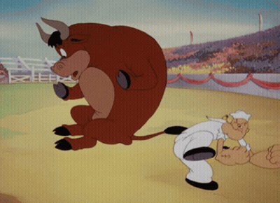 A Cartoon Of A Man And A Bull In A Stadium GIF