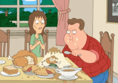 A Cartoon Of A Man And A Woman Sitting At A Table With Food On It GIF