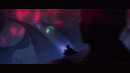 A Cartoon Of A Man Holding A Gun With A Light Coming Out Of It GIF
