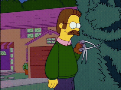 A Cartoon Of A Man Holding A Pair Of Scissors GIF