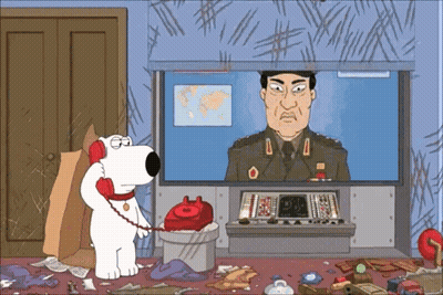 A Cartoon Of A Man In A Military Uniform Talking On A Red Phone GIF