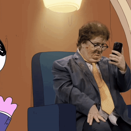 A Cartoon Of A Man In A Suit And Tie Looking At His Phone GIF