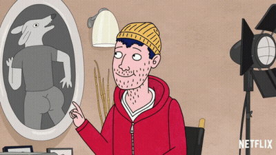 A Cartoon Of A Man Pointing At A Picture Of A Wolf On The Wall GIF