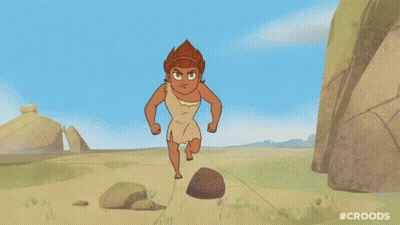 A Cartoon Of A Man Running On A Dirt Road Next To Rocks . GIF