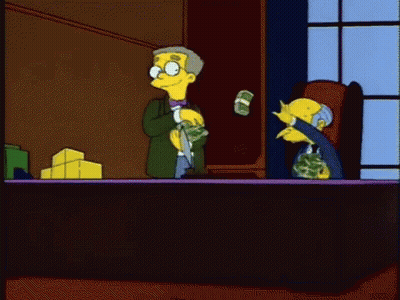 A Cartoon Of A Man Sitting At A Desk With Money Flying Around Him GIF